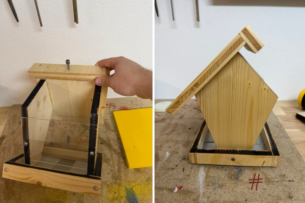 Seitliche Ansicht des Vogelfutterhauses mit klappbarem Dach; Schraube dient als Verschluss.