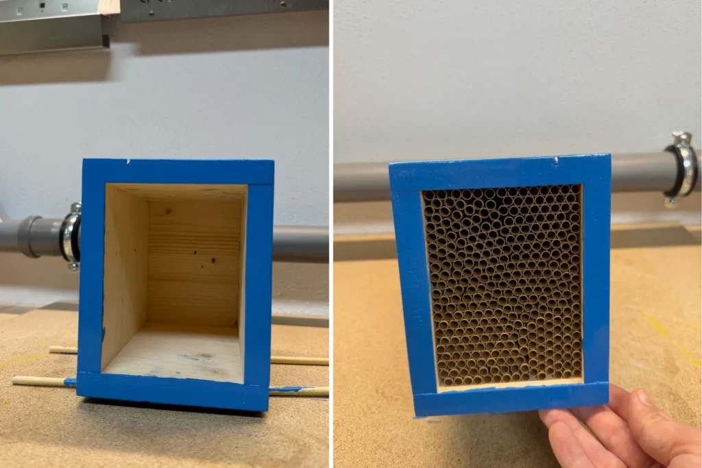 Blau lackierter Rahmen einer Nisthilfe wird mit Niströhrchen befüllt.