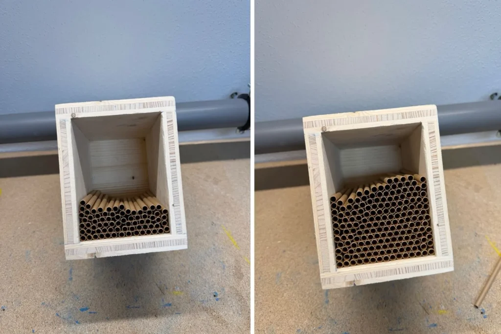 Nisthülsen werden senkrecht und dicht aneinandergesteckt in den Korpus der Wildbienen-Nisthilfe eingesetzt